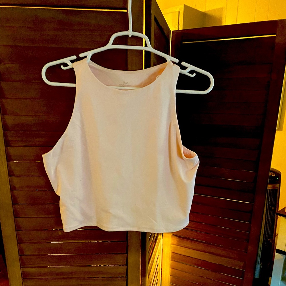 Light pink cropped razor back tank top. Size XL